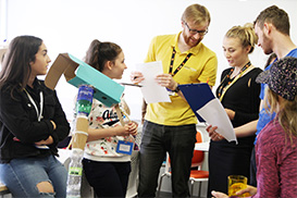 Casey Hopkins and Luke Clements talking with staff at a technocamps session