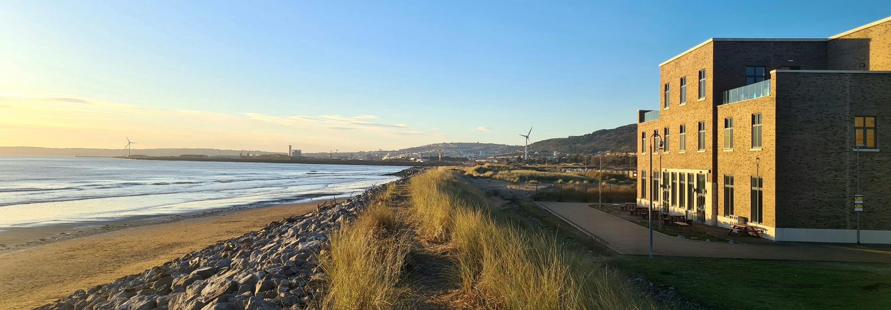 The College building on the edge of he Swansea University Bay Campus overlooking the beach.