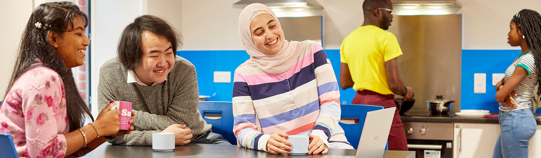 Students in the kitchen at the Rod Jones Hall accommodation on Swansea University Bay Campus.