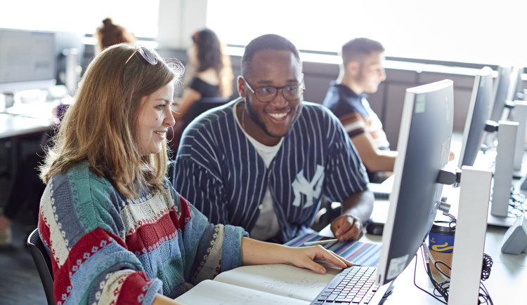 students working together in the computer lab