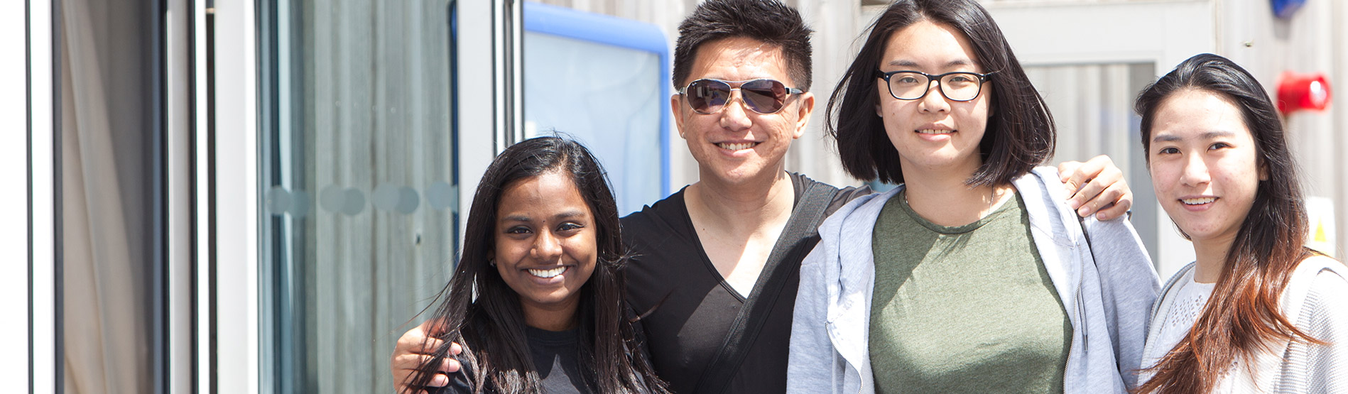 Students posing for a photo in the sun.