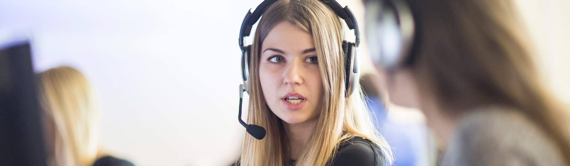 Student wearing headset while doing a translation exercise.