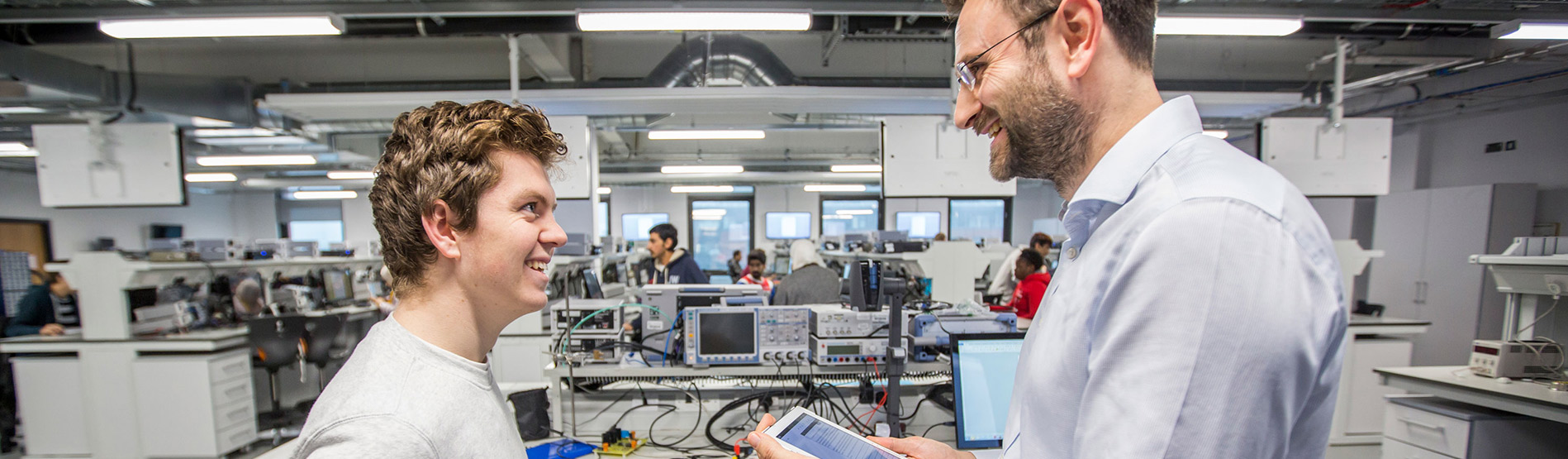 Student and lecturer in an Engineering lab.