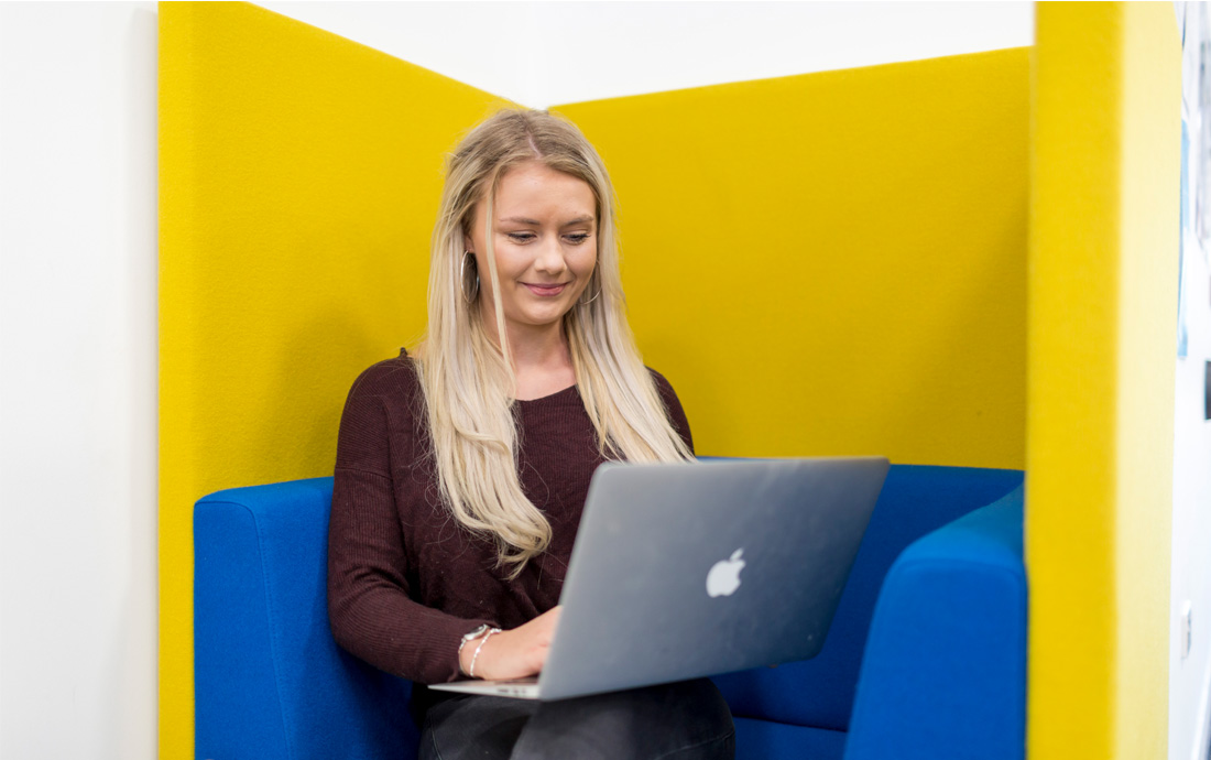 A female student working on a laptop