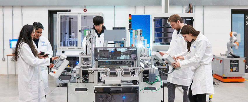 mechanical engineering students in dynamics lab