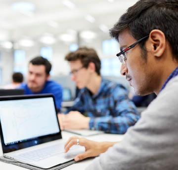 student working on a laptop