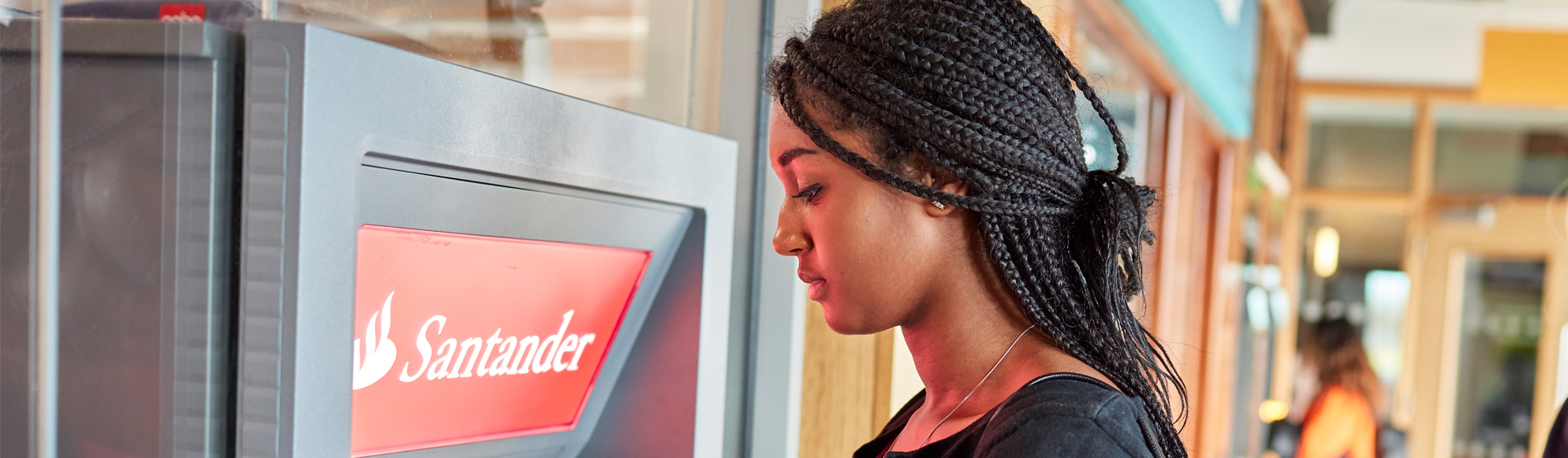 student at a Santander cashpoint