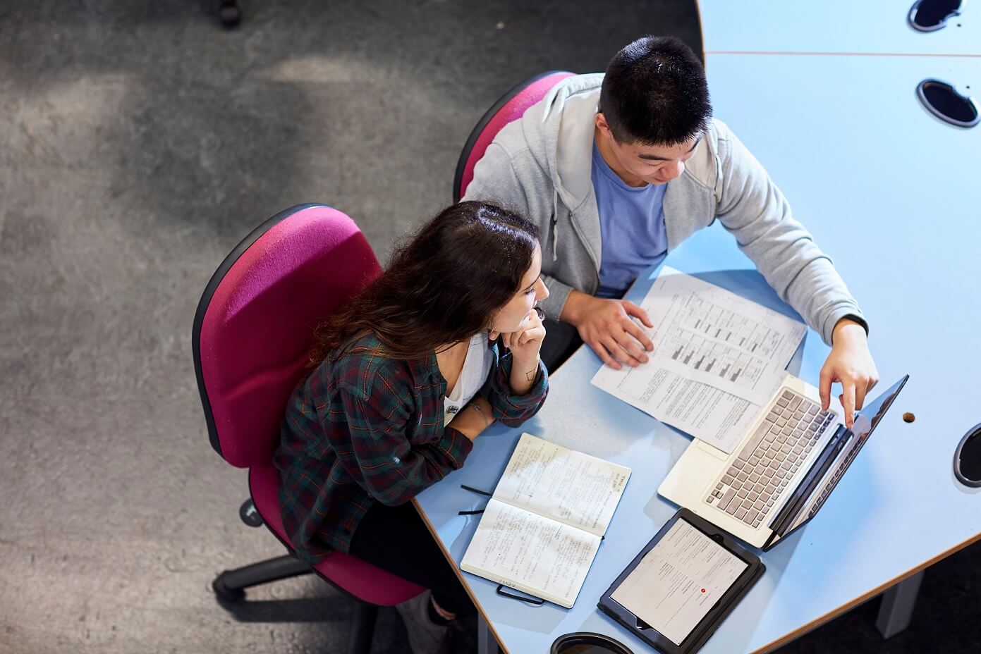 Student sat at laptop on a desk