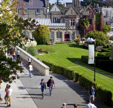 Student walking along Singleton Campus Mall