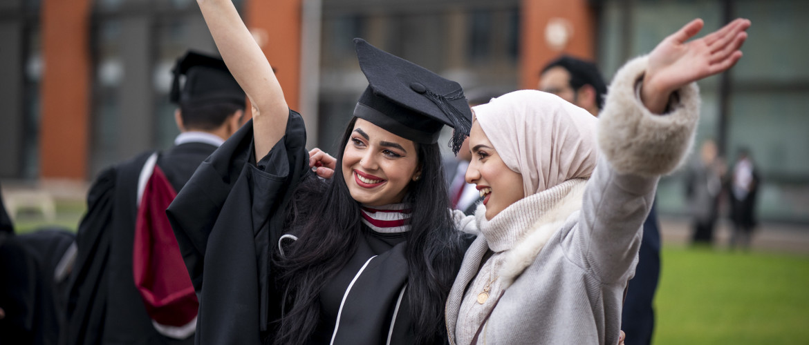 Students sat in a lecture theatre for graduation